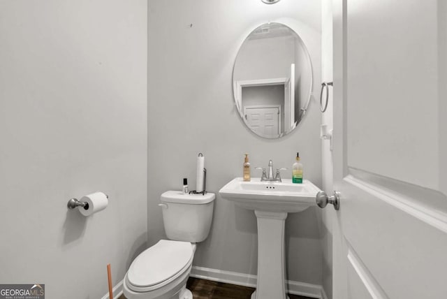 bathroom featuring sink and toilet