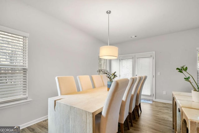 dining room with dark hardwood / wood-style flooring