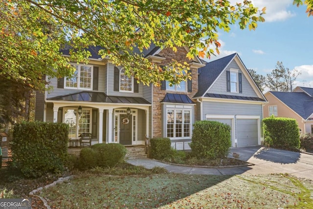 view of front facade featuring a porch and a garage