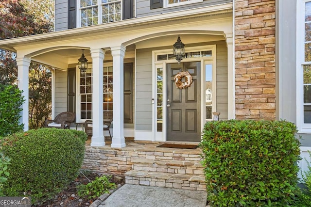 entrance to property featuring covered porch