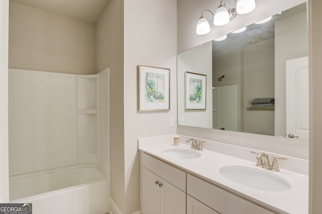 bathroom featuring vanity and washtub / shower combination