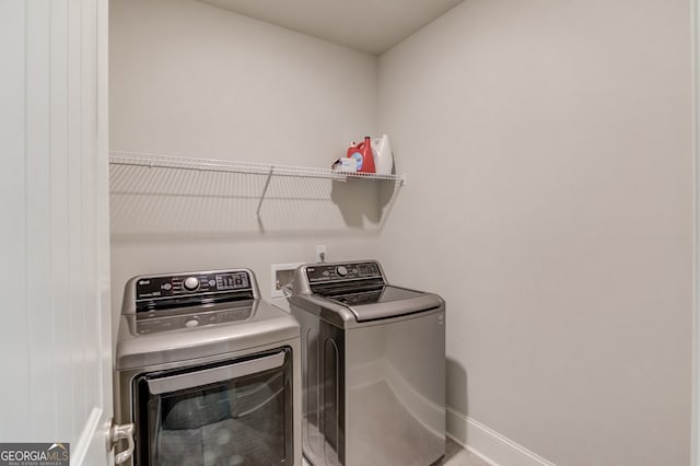 laundry area with washing machine and dryer