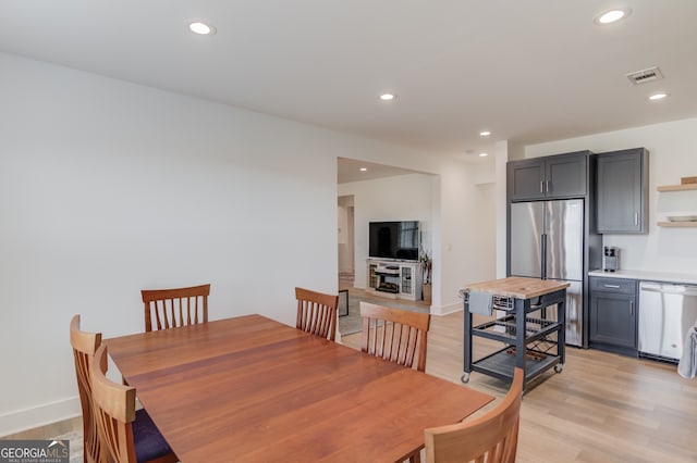 dining room featuring light hardwood / wood-style floors