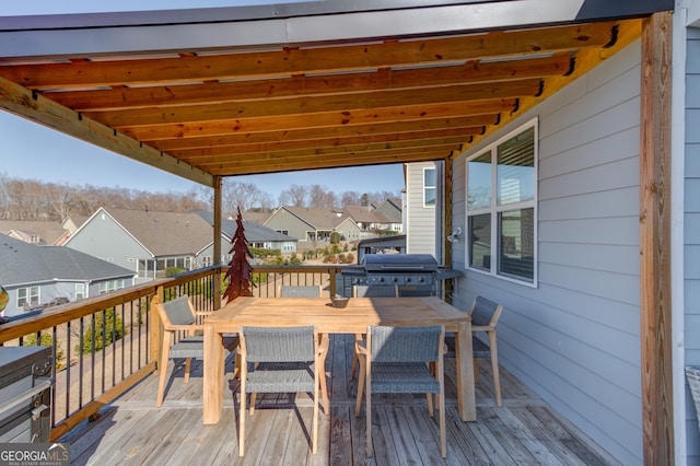 wooden terrace featuring a grill