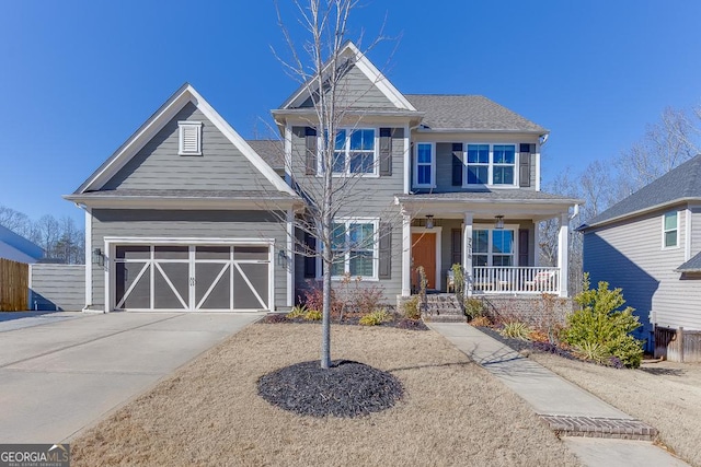 view of front of home with covered porch and a garage