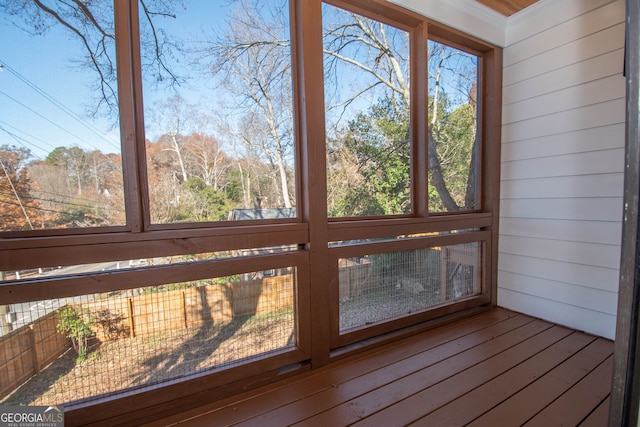 unfurnished sunroom featuring plenty of natural light