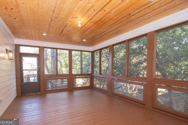 unfurnished sunroom featuring wood ceiling