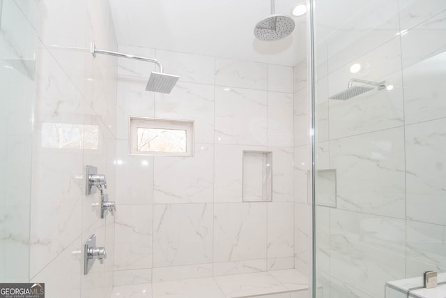 bathroom with tiled shower