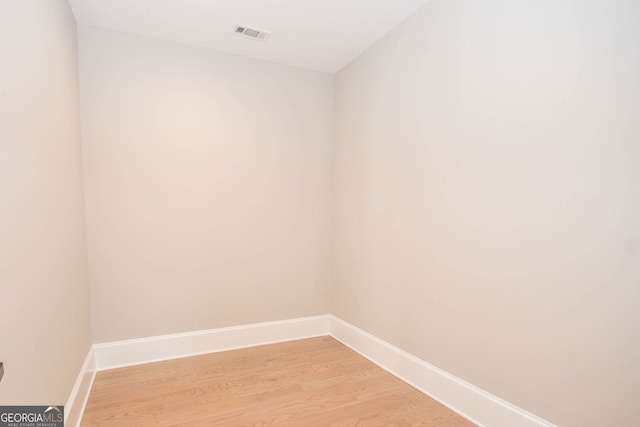 unfurnished room with light wood-type flooring