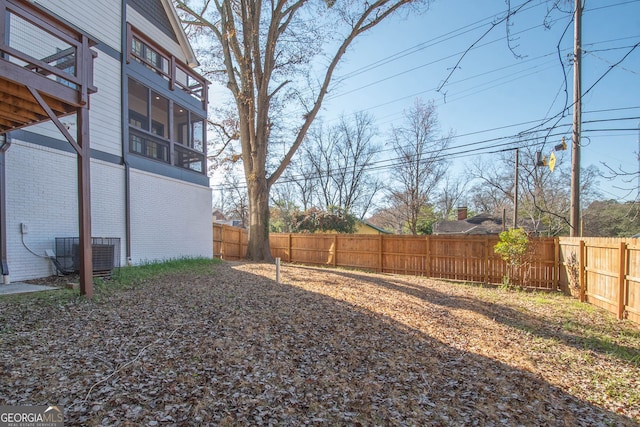 view of yard featuring central AC unit