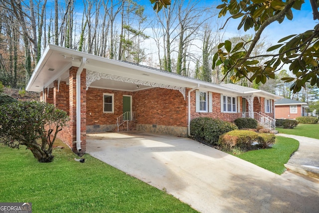 single story home featuring a front lawn and a carport