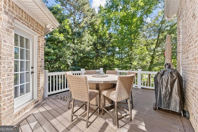 deck with outdoor dining area