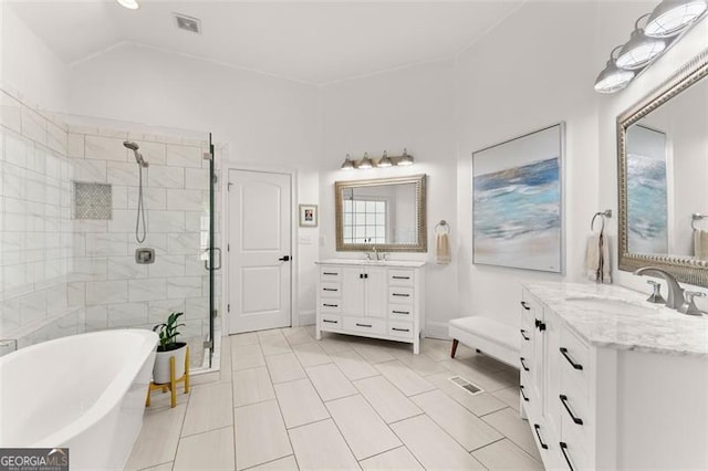 bathroom featuring tile patterned floors, vanity, and separate shower and tub