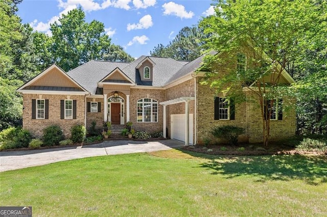 view of front of home with a garage and a front lawn