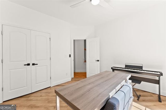 office space with ceiling fan and light hardwood / wood-style flooring