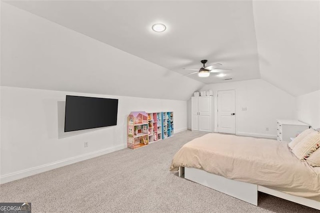 bedroom featuring ceiling fan, carpet floors, and vaulted ceiling