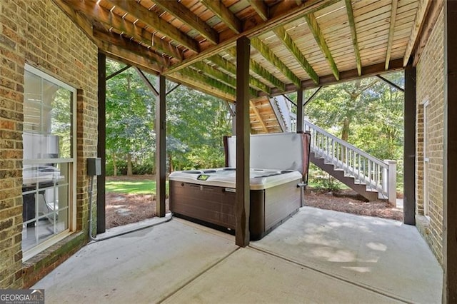 view of patio with a hot tub