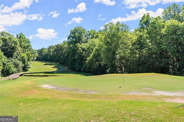 view of property's community featuring a lawn