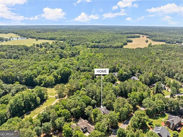 bird's eye view featuring a view of trees