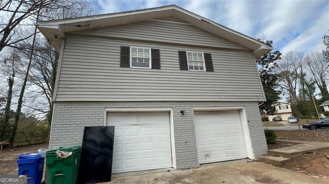 view of side of property featuring a garage