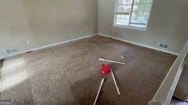 empty room with dark carpet