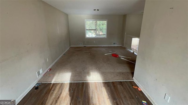 spare room featuring hardwood / wood-style flooring