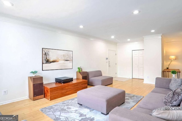 living room featuring light hardwood / wood-style flooring and ornamental molding