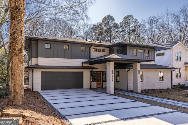 view of front of home featuring covered porch and a garage