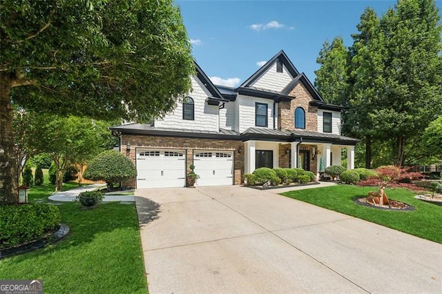 craftsman inspired home featuring a garage and a front lawn