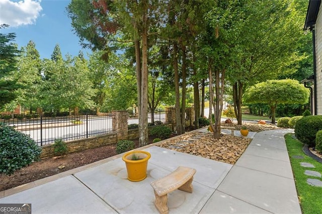 surrounding community featuring a patio area