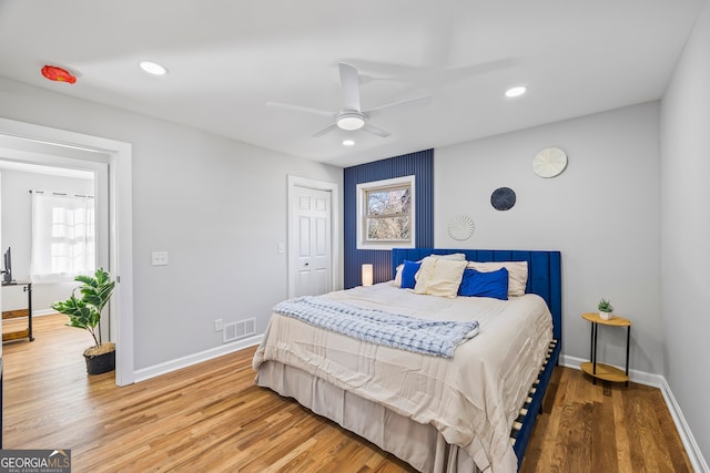 bedroom featuring hardwood / wood-style flooring and ceiling fan