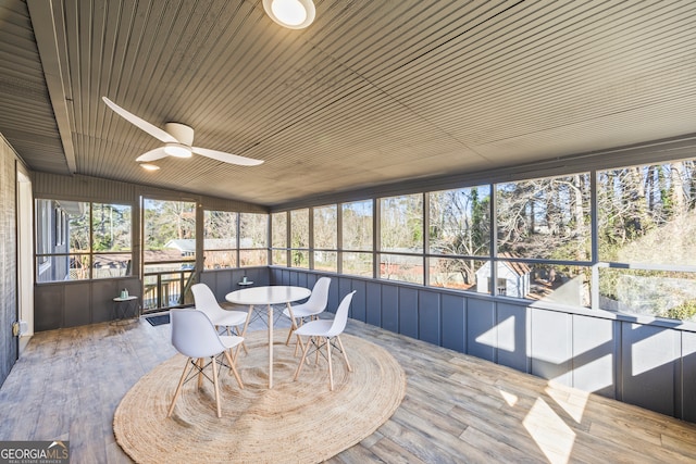 sunroom / solarium featuring ceiling fan, lofted ceiling, and wood ceiling