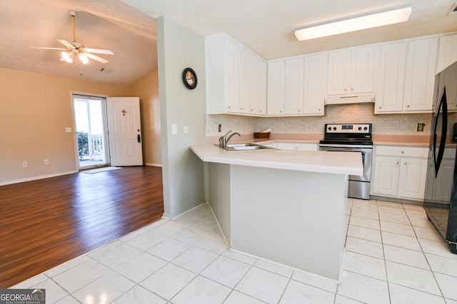 kitchen featuring stainless steel electric stove, kitchen peninsula, sink, and white cabinets