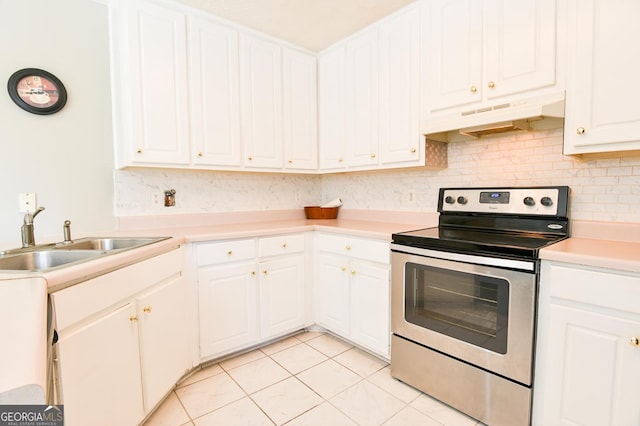 kitchen featuring white cabinetry, sink, stainless steel range with electric cooktop, and light tile patterned flooring