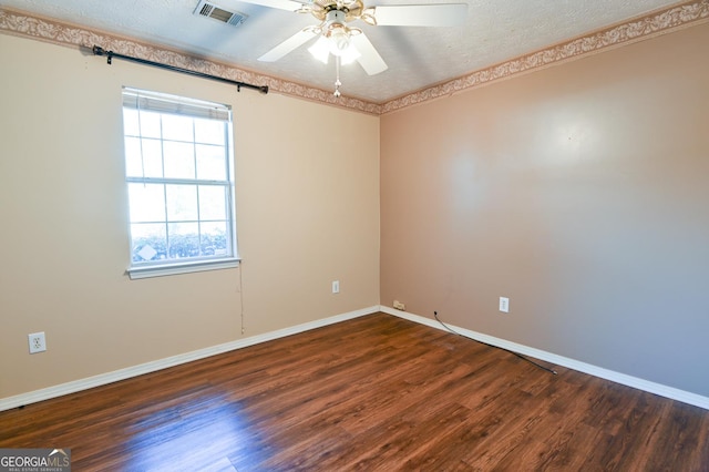 unfurnished room with a textured ceiling, ceiling fan, and dark hardwood / wood-style floors