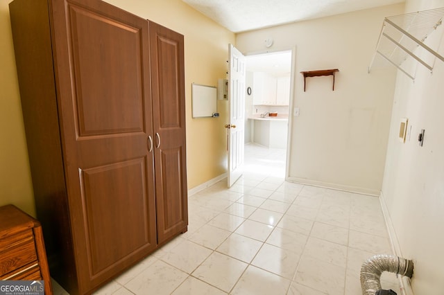 corridor with light tile patterned floors