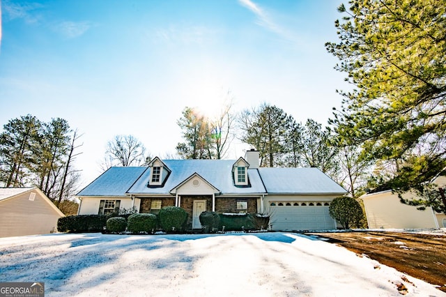 new england style home with a garage