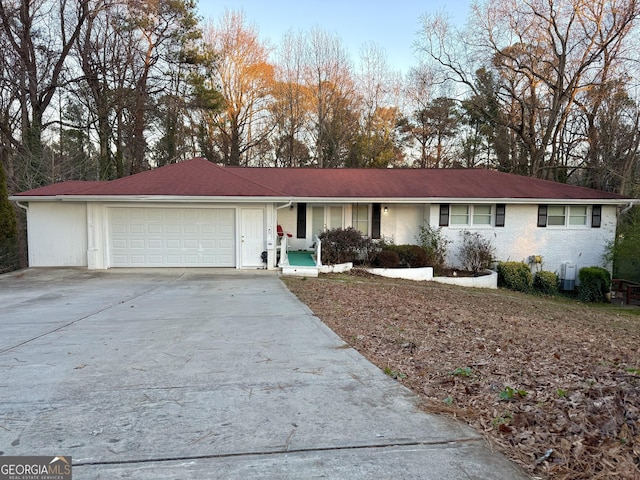 ranch-style house featuring a garage