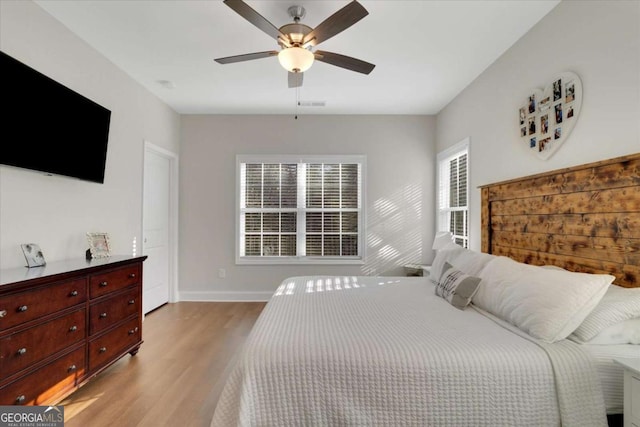 bedroom featuring ceiling fan and light hardwood / wood-style flooring