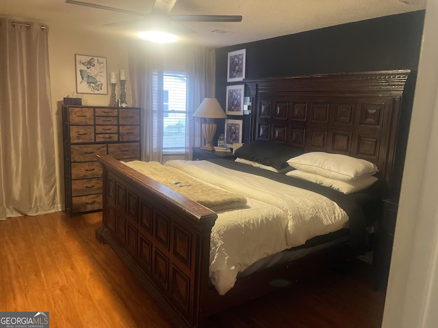 bedroom featuring hardwood / wood-style flooring and ceiling fan