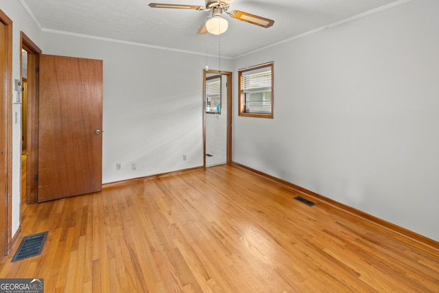 unfurnished room with ceiling fan, light hardwood / wood-style flooring, and ornamental molding