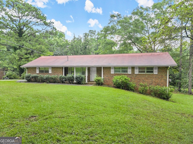 ranch-style house with a front lawn