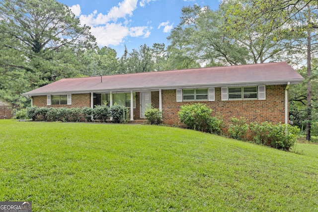 ranch-style house with a front lawn