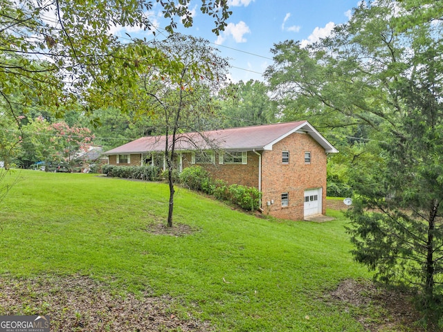 exterior space with a front yard and a garage