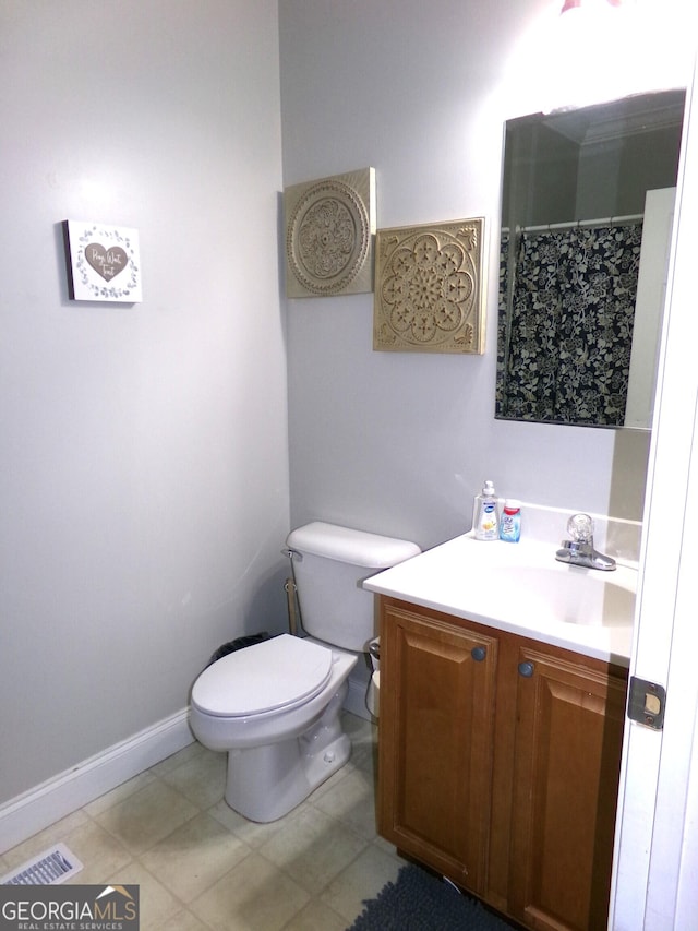 bathroom with vanity and toilet