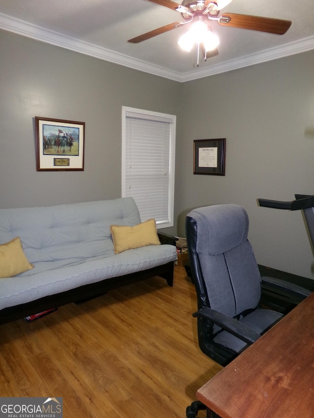 office space with wood-type flooring, ceiling fan, and ornamental molding