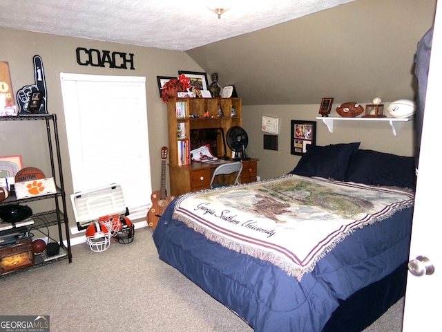 bedroom featuring carpet flooring, lofted ceiling, and a textured ceiling