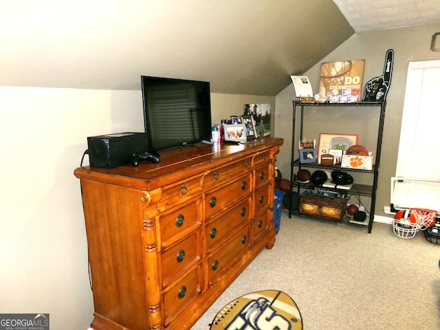 interior space featuring carpet and lofted ceiling