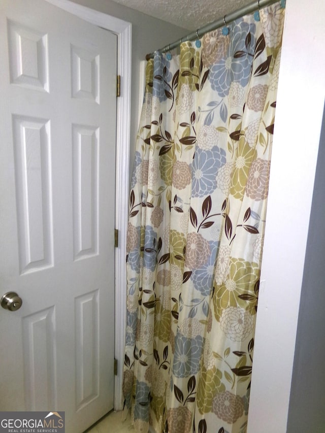 bathroom with curtained shower