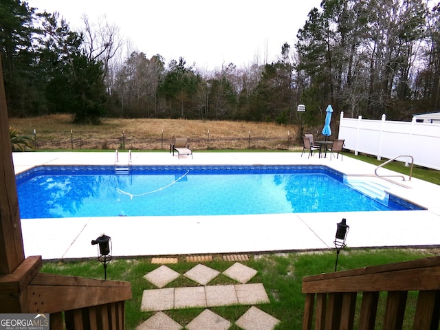 view of pool featuring a patio area